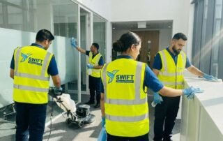 Swift Cleaning Services Cleaners team member deep cleaning a rental kitchen countertop during a professional bond clean in Adelaide